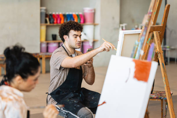istock Middle Eastern Artist Painting in Studio with Smartphone 2200566167