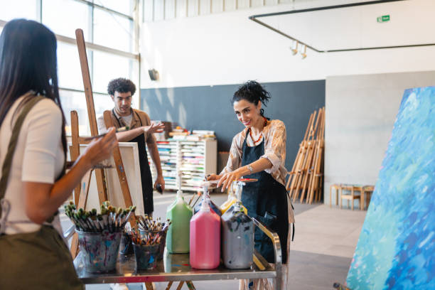 istock Young Middle Eastern Female Mixing Paints in Art Studio 2200566193