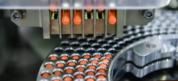istock Capsule medicine pill production line, Industrial pharmaceutical concept. 2200566706