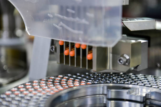 istock Capsule medicine pill production line, Industrial pharmaceutical concept. 2200568476