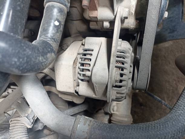 istock dull alternator installed on the car. Dirty alternator dynamo 2200571597