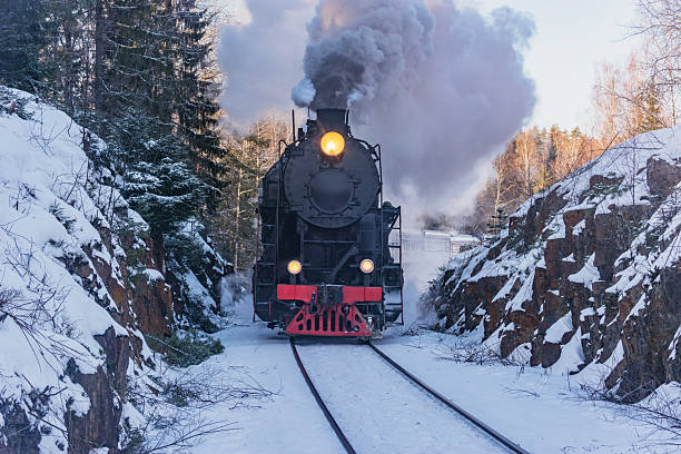 istock Retro train moves at winter morning. 2200572095