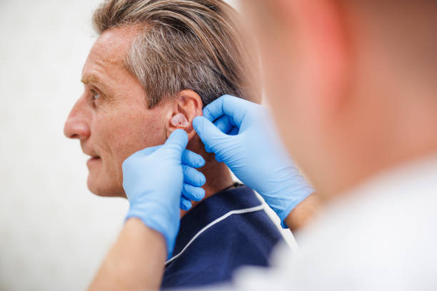 Mature Caucasian Male Receiving Customized Hearing Aid