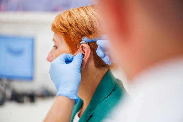 istock Senior Woman Undergoing Hearing Evaluation with Specialist 2200573222