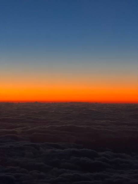 istock A view of sunset over horizon from inside a plane 2200577846