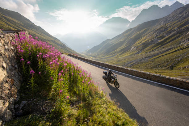 istock Motorbiker riding in Italian Alps 2200579229