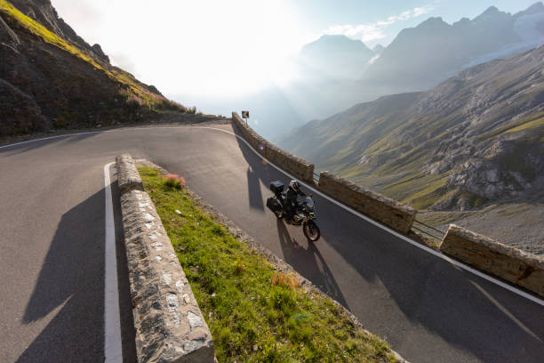 istock Motorbiker riding in Italian Alps 2200579301