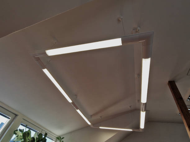 istock The lamp can be attached directly to the ceiling or suspended using cables. Ropes for hanging are included in the package. in the shape of a rectangle above the table in the attic meeting room 2200579745