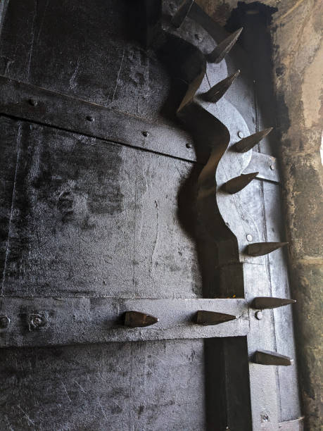 Junnar-Pune, Maharashtra-India, 11.09.2024: Maha Darwaza main first Gate huge door with spikes, Shivneri fort vertical frame