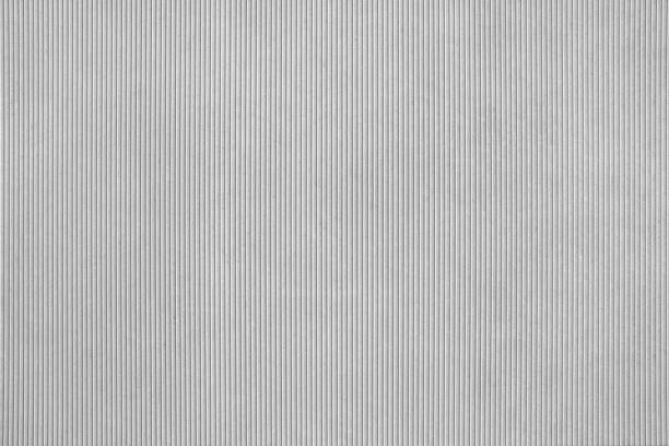 Gray concrete slab with fine vertical grooves in close-up