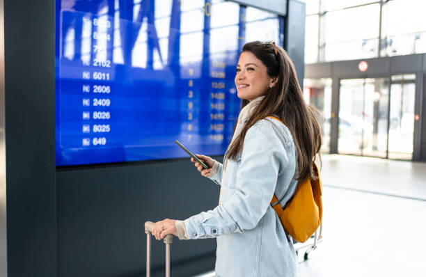 istock Young woman passenger at the train station 2200581721