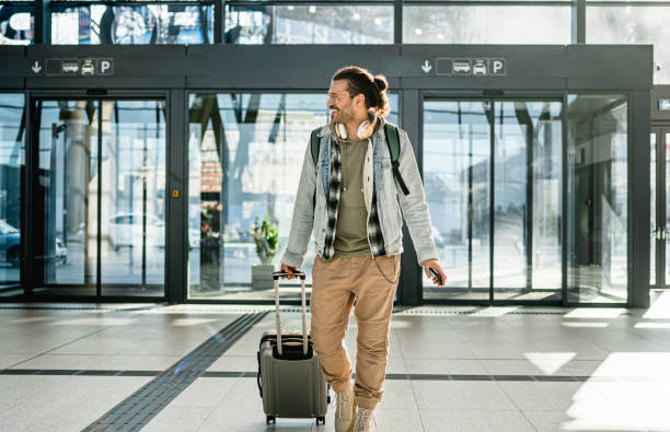 istock Young man passenger at the train station 2200582068