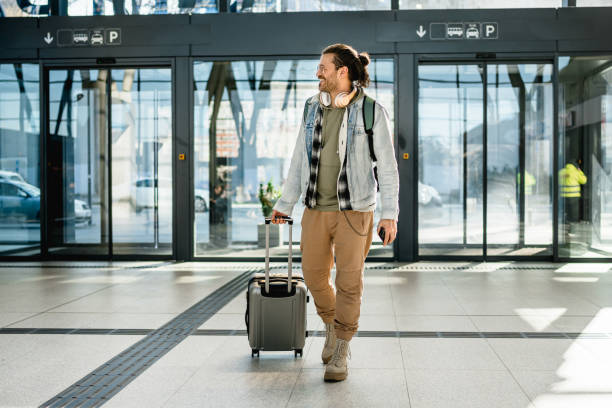 istock Young man passenger at the train station 2200582073
