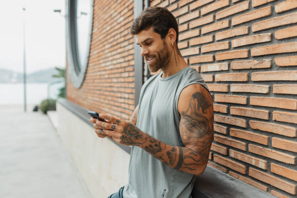 istock Attractive young tatooed man portrait 2200584588