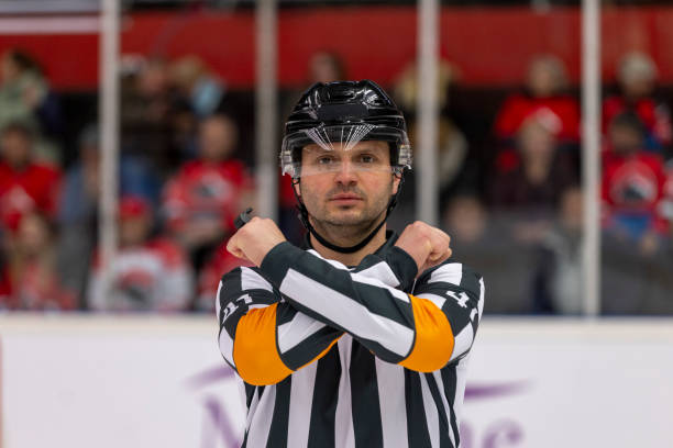 istock Caucasian Male Referee Gesturing During Ice Hockey Game 2200585893