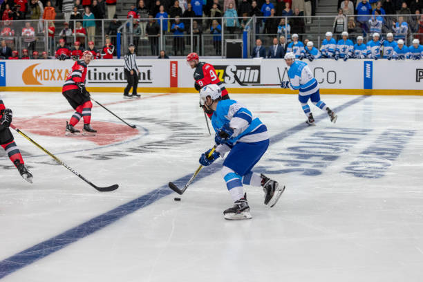 istock Professional Ice Hockey Game With Intense Action Under Bright Arena Lights 2200585956