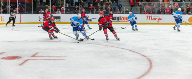 istock Intense Ice Hockey Match with Red and Blue Teams Competing 2200585966