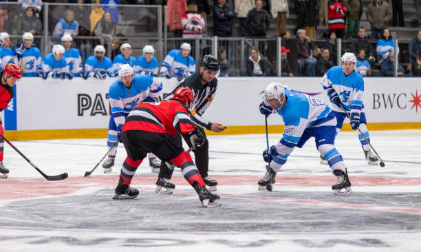 istock Intense Ice Hockey Faceoff Between Rival Teams in Arena 2200585968