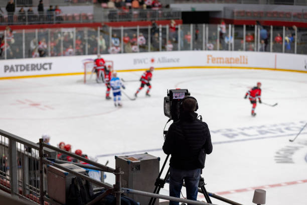 istock Professional Ice Hockey Game Filmed by Camera Operator Indoors 2200586062