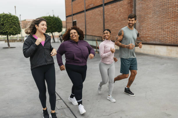 istock Group of Friends Jogging Outdoors in Urban Setting 2200586438