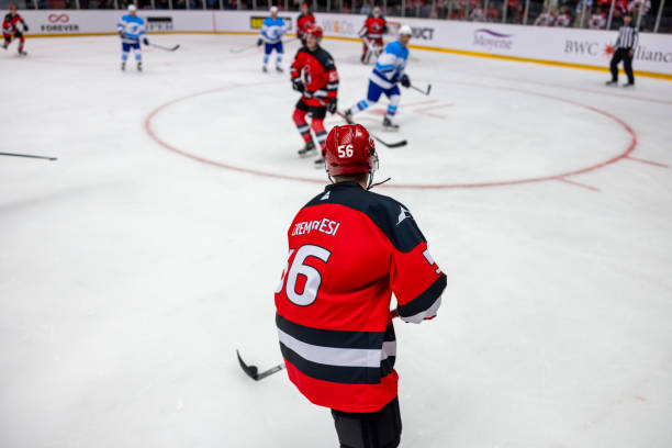 istock Intense Ice Hockey Match with Dynamic Player Action 2200586617