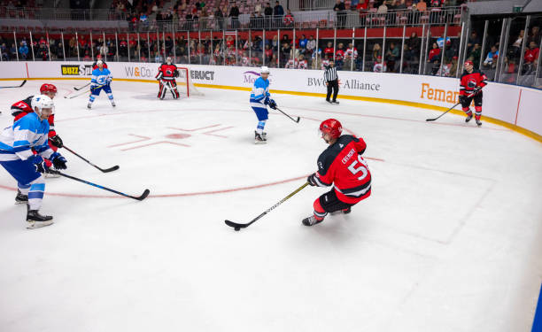 istock Intense Ice Hockey Match with Competitive Action on Ice 2200586633