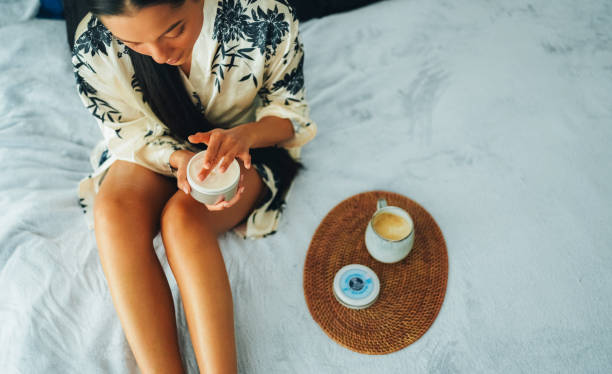 istock Woman at home using shea butter body cream 2200586746