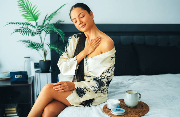 istock Woman at home using shea butter body cream 2200586951