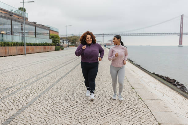 istock Jogging Together Along the Scenic Pathway 2200587030