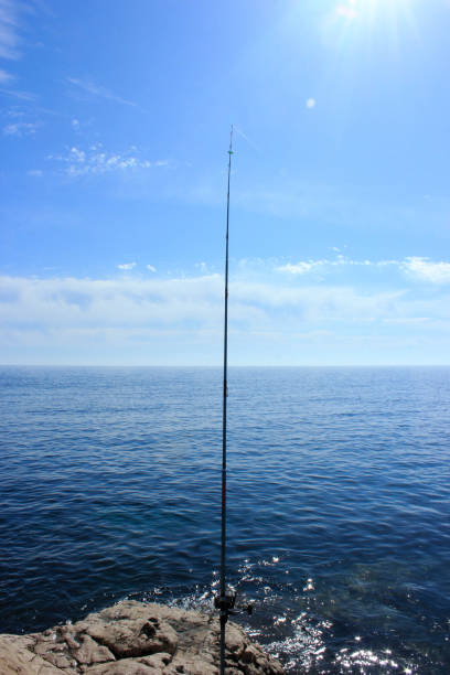 istock amateur fishing with a rod 2200587268