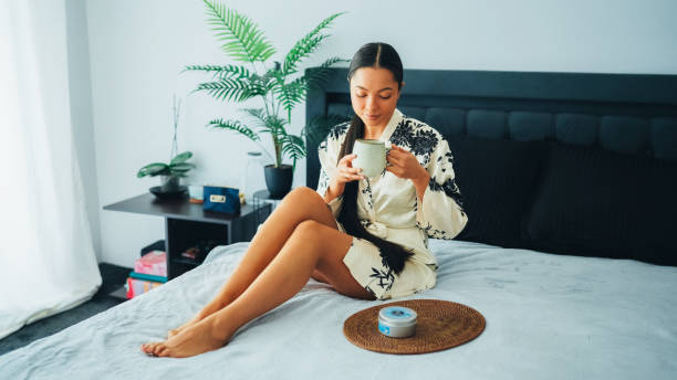 istock Woman at home using shea butter body cream 2200587584