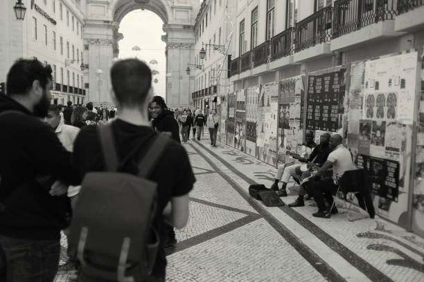 Lisbon, Portugal - November 30, 2024: A trio of african street musicians play percussion at the Rua Augusta street in Lisbon downtown.