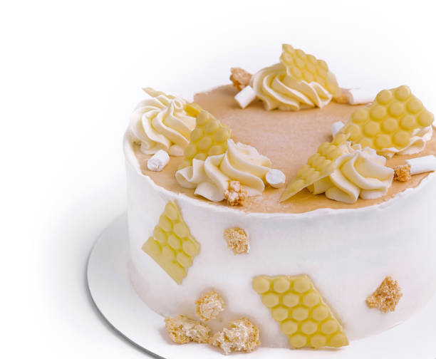 istock Sweet cake with white chocolate and crumble topping on white background 2200590401