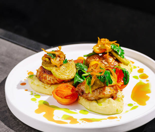 istock Deliciously plated dish featuring sauteed vegetables and protein in a modern dining setting with minimalistic design 2200591031