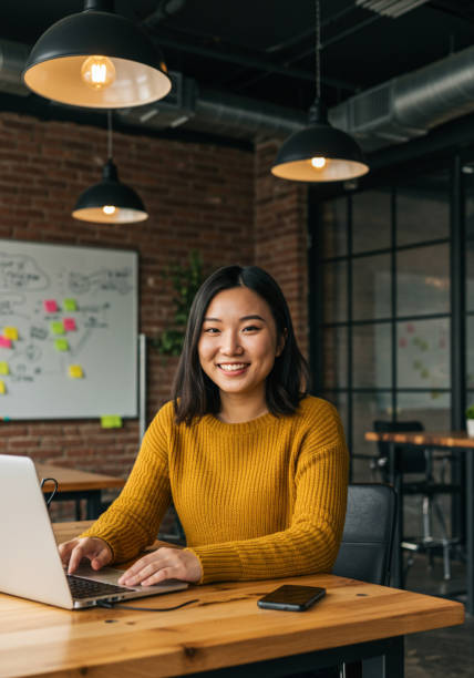 istock Young Asian Woman in a Startup Environment 2200591566