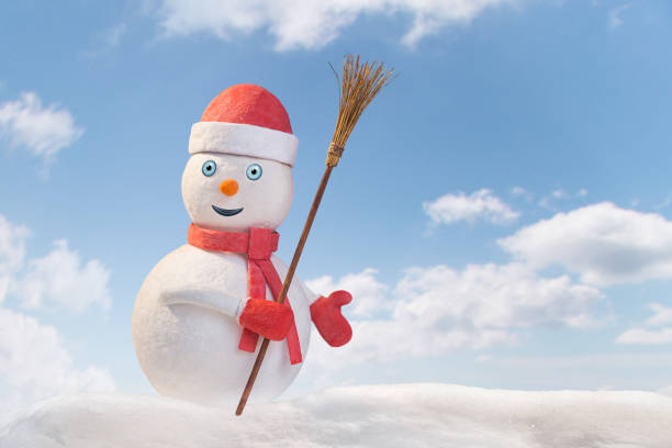istock smiling snowman in red clothes with broom 2200592472