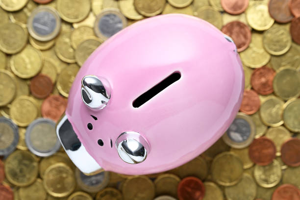 istock Piggy bank with coins closeup 2200592775