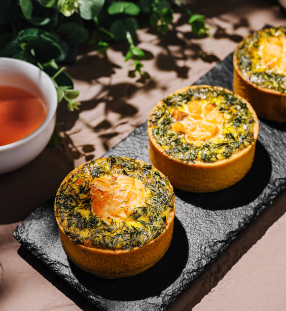 istock Tasty savory pastries on a slate platter with herbal tea 2200593331