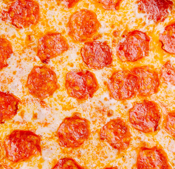 Delicious pepperoni pizza with crispy crust and melted cheese on a white background