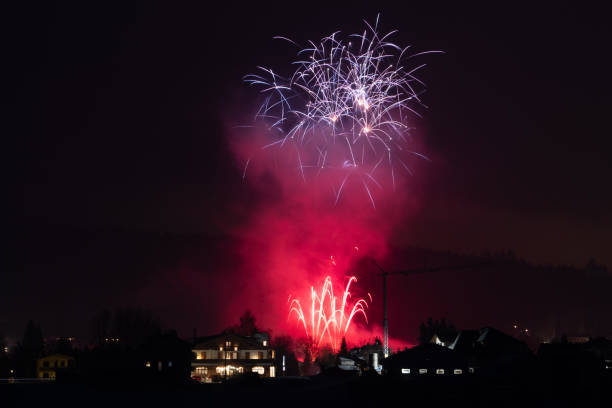 istock fireworks in the night winter sky in venetian alps 2200596221