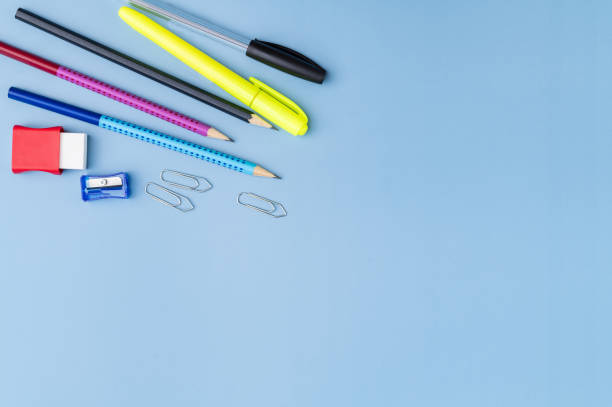istock Back to school backdrop. School supply over light blue background with copy space 2200597514