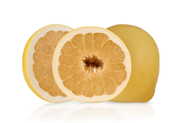 istock A pomelo fruit, known for its large size and thick yellow skin, sits beside two halves exposing its juicy, pale flesh. Ideal for refreshing summer snacks or salads 2200597584