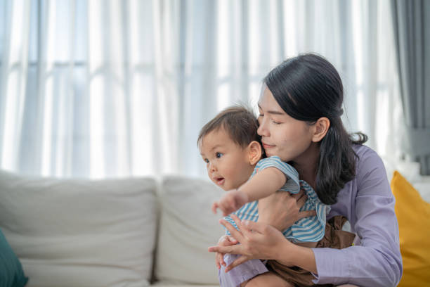 istock Mother embracing toddler while playing joyfully indoors during daylight hours 2200598466