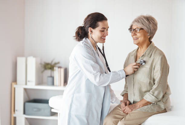 istock patient with a doctor in medical office 2200603255