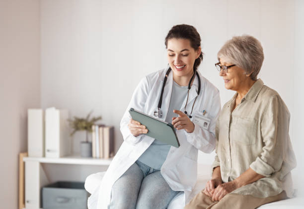 istock patient with a doctor in medical office 2200603395
