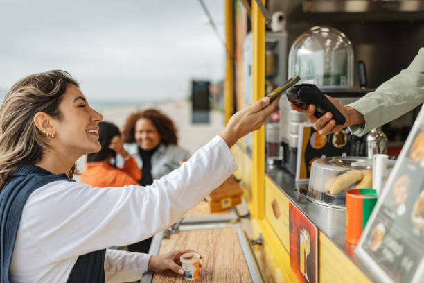istock Friendly Exchange at a Food Truck Setup 2200604432