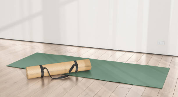 istock Blank colored rolled unfolded yoga mat in sport area mockup 2200607480