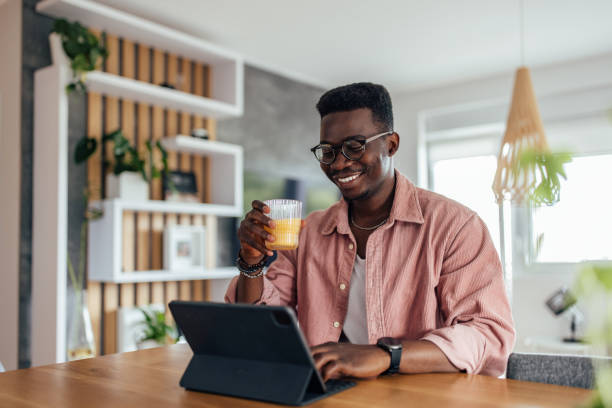 istock Adult black man, taking a work break, in home office. 2200607928
