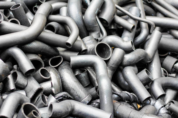 istock Pile of grey rubber connecting pipes as background 2200609458