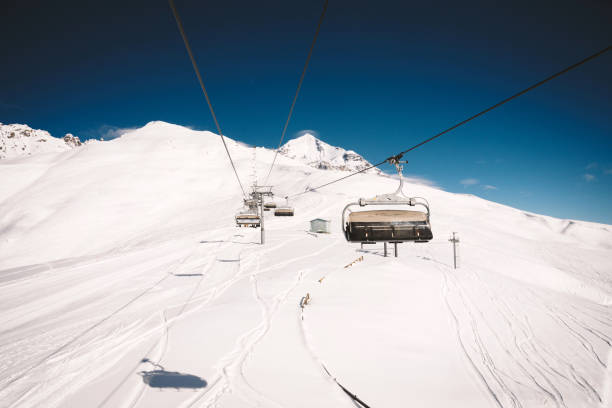 Ski resort slope and ski lft. Alpine ski / snowboard vacation.